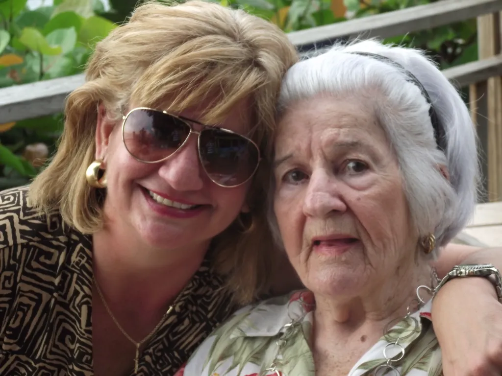 Yasmin Goetz smiling outdoors with her mother